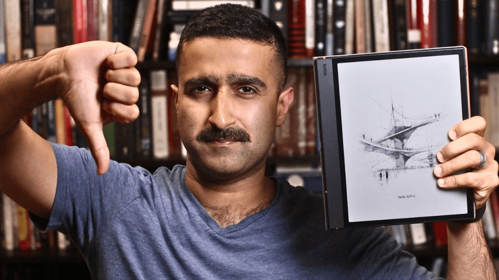 A person showing boox note air 5c in one hand and thumbs down on another